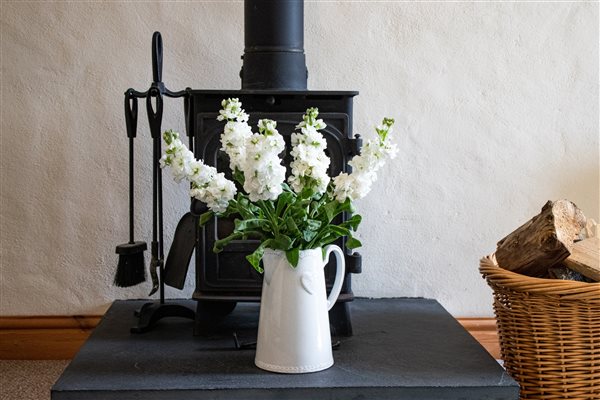 Fresh flowers and a wood burner in every cottage.